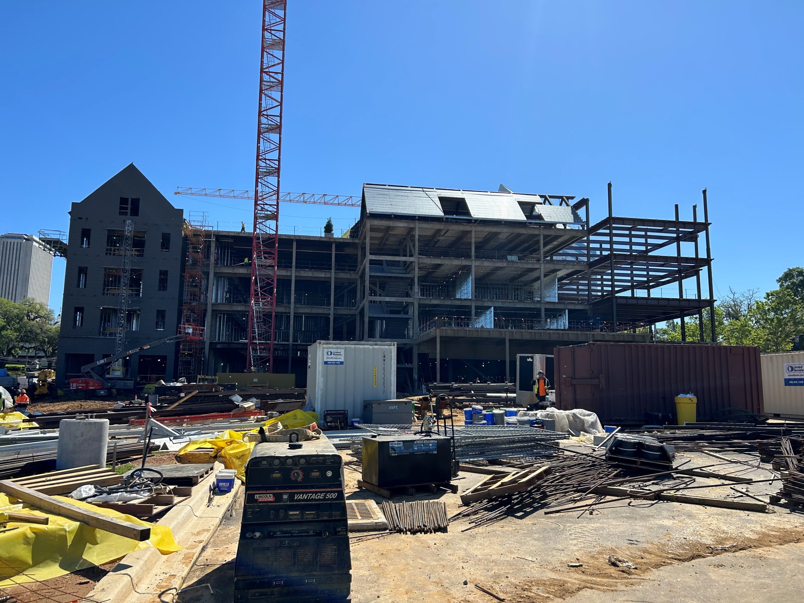 Florida State University project under construction, a steel frame rising beside a brick building